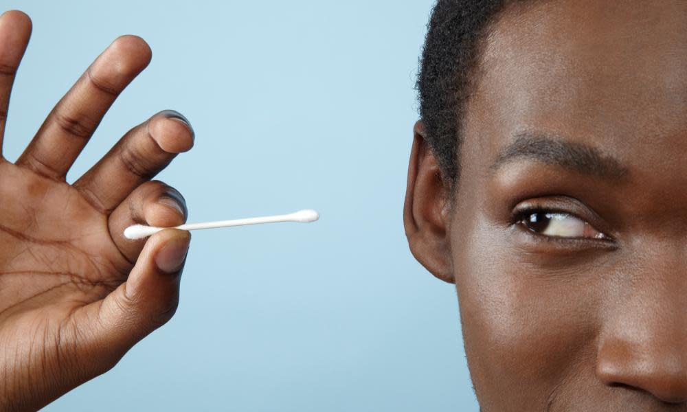 Man holding cotton bud