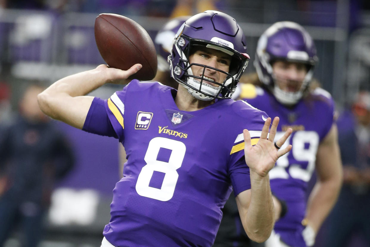 FILE - In this Dec. 30, 2018 file photo, Minnesota Vikings quarterback Kirk Cousins warms up before an NFL football game against the Chicago Bears in Minneapolis. Guaranteed payments for unrestricted free-agent contracts this month make up just over half of the total money to be paid, down a bit from 2018, when Kirk Cousins signed a fully guaranteed $84-million deal. (AP Photo/Bruce Kluckhohn, File)