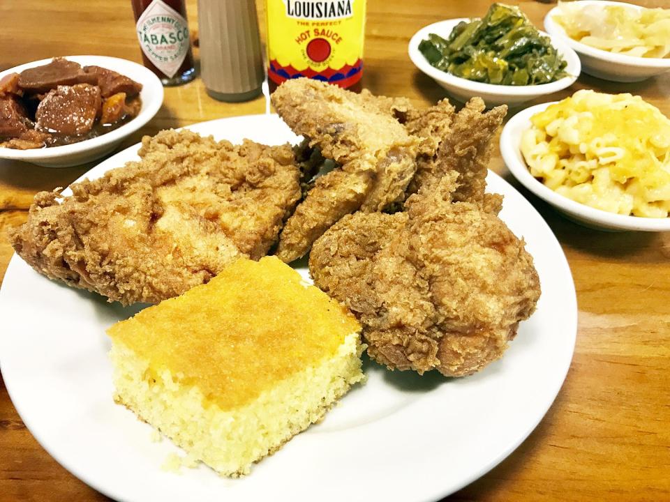 Shut Em Down offers three pieces of fried white meat chicken, two sides of your choosing and a slab of warm cornbread.