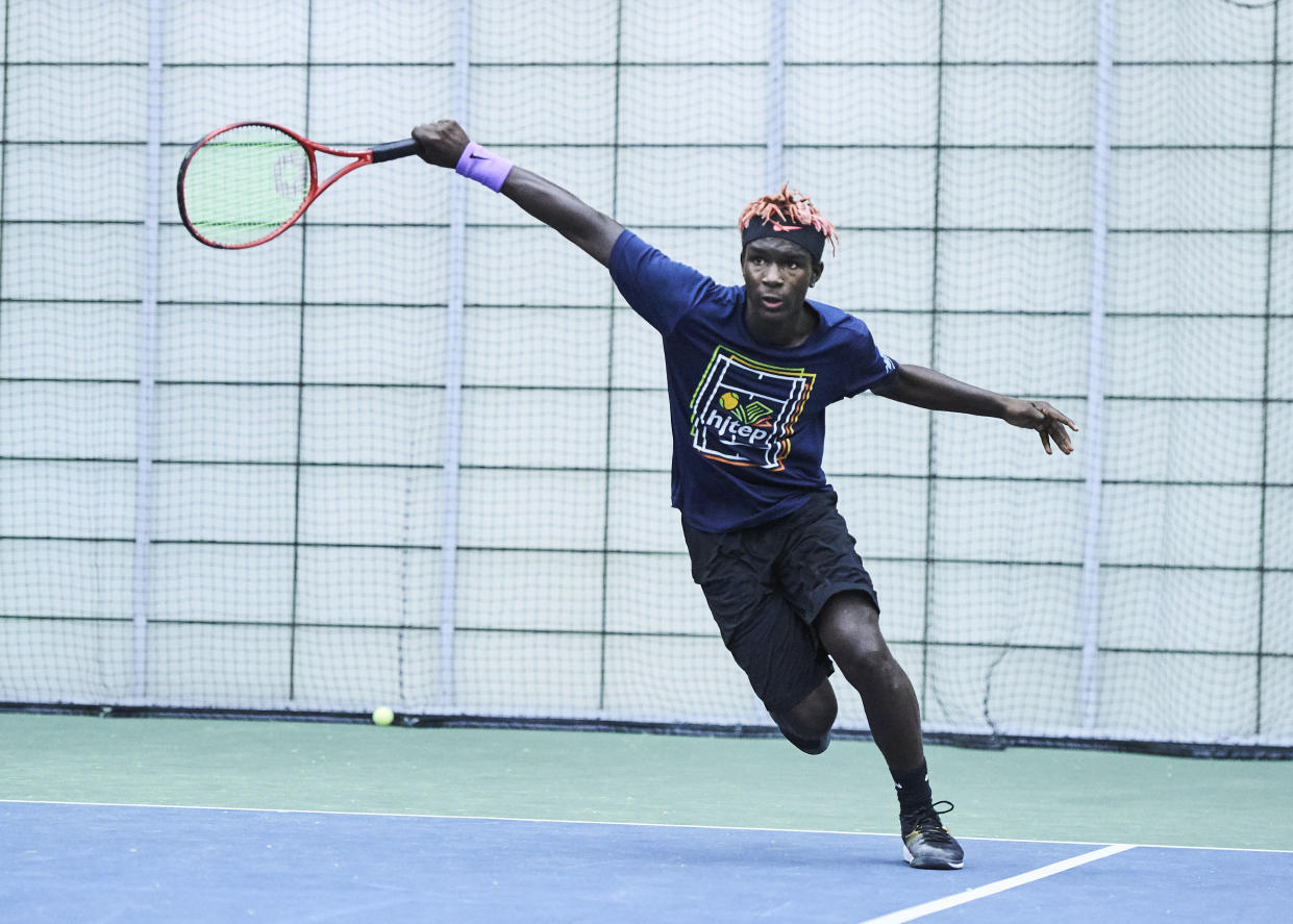 Donovan Spigner returns a shot during a tennis match. (Courtesy of Simone Spigner)