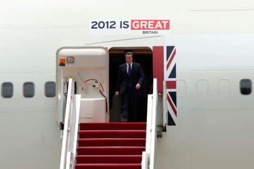 British Prime Minister David Cameron at Kuala Lumpur International Airport in Sepang, outside Kuala Lumpur on April 12, 2012. Cameron has called on the international community to "get behind" burgeoning reforms in Myanmar ahead of his scheduled historic visit to the country