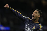 Real Madrid's Jude Bellingham celebrates at the end of the Champions League quarterfinal second leg soccer match between Manchester City and Real Madrid at the Etihad Stadium in Manchester, England, Wednesday, April 17, 2024. (AP Photo/Dave Shopland)