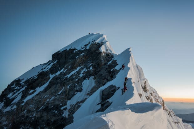 Summiting Mount Everest at 29,029 feet. 