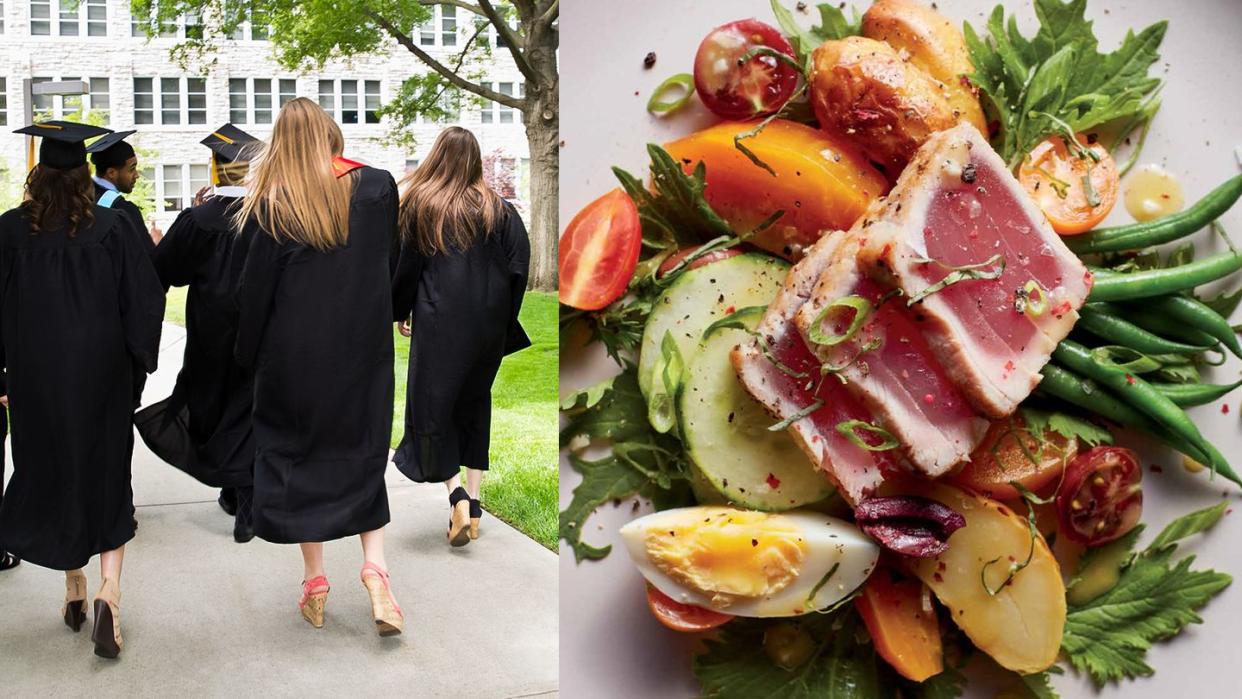 a group of people in college graduation gowns and dining hall food