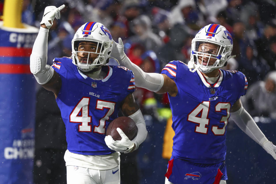 Buffalo Bills cornerback Christian Benford (47) reacts with cornerback Tre Norwood (43))after intercepting a pass against the Dallas Cowboys during the fourth quarter of an NFL football game, Sunday, Dec. 17, 2023, in Orchard Park, N.Y. (AP Photo/Jeffrey T. Barnes)