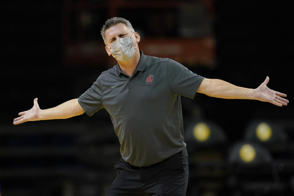 Washington State head coach Kyle Smith gestures toward officials during the first half of his team's NCAA college basketball game against Stanford in Santa Cruz, Calif., Saturday, Jan. 9, 2021. (AP Photo/Jeff Chiu)