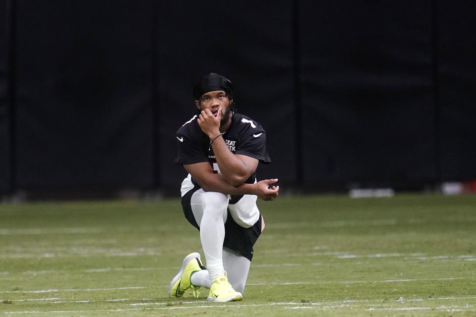 Arizona Cardinals quarterback Kyler Murray watches teammates during the NFL football team's training camp Saturday, July 30, 2022, in Glendale, Ariz. Murray was given the day off from practice. (AP Photo/Ross D. Franklin)