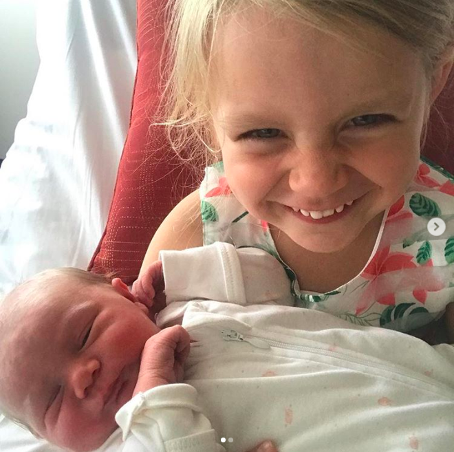 Evie with baby Adelaide. Photo: Instagram/Carrie Bickmore