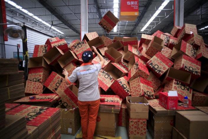An employee works at a Tmall logistic centre in Suzhou, Jiangsu province, China, October 28, 2015. Picture taken October 28, 2015. REUTERS/Aly Song/File Photo