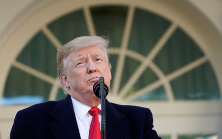 FILE PHOTO: U.S. President Donald Trump pauses as he announces a deal to end the partial government shutdown as while speaking in the Rose Garden of the White House in Washington, U.S., January 25, 2019. REUTERS/Kevin Lamarque
