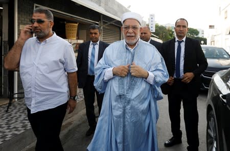 Abdelfattah Mourou, vice president of the moderate Islamist Ennahda party and presidential candidate, arrives to cast his vote during presidential election in Tunis