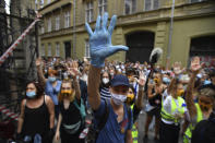 Students of the University of Theatre and Film Arts (SZFE) and their sympathizers form a human chain in protest against changes to the way the university is governed in Budapest, Hungary, Sunday, Sept. 6, 2020. (Marton Monus/MTI via AP)