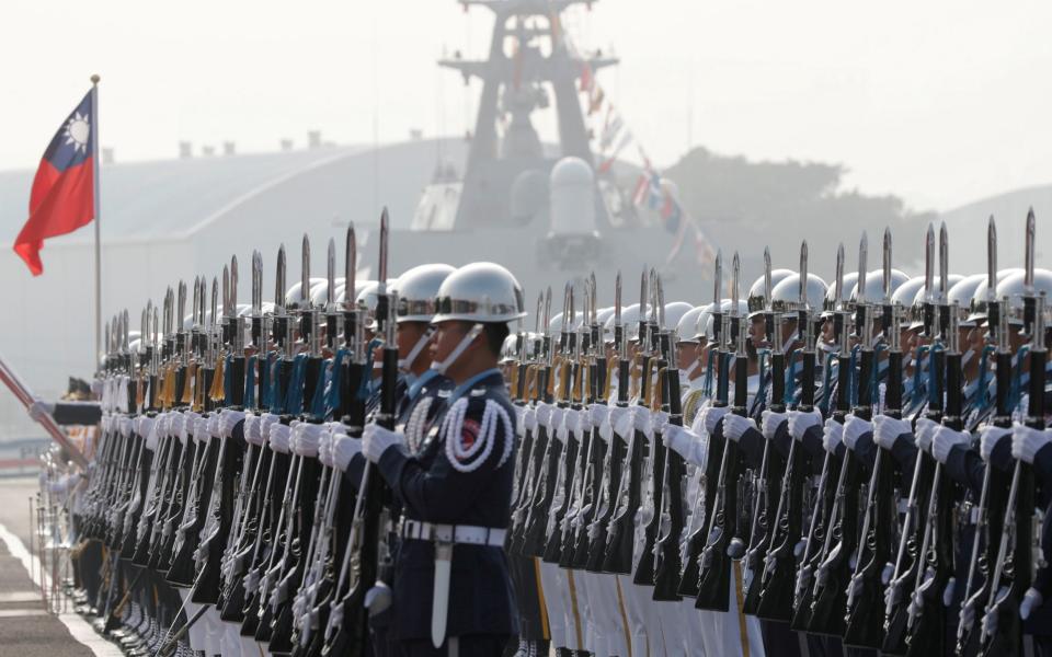 Taiwan's navy sailors take part in a commissioning ceremony of guided missile frigates in 2018 - Reuters