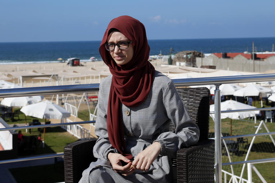 Palestinian student Afaf al-Najar, speaks during an interview at the sea side beach restaurant in Gaza City, Wednesday, Nov. 3, 2021. Al-Najar is fighting to travel out of the Palestinian enclave to Turkey, where he has won a scholarship, but her father banned her, taking advantage of a new Hamas ruling that bars women from traveling against the well of their male "guardians.". (AP Photo/Adel Hana)