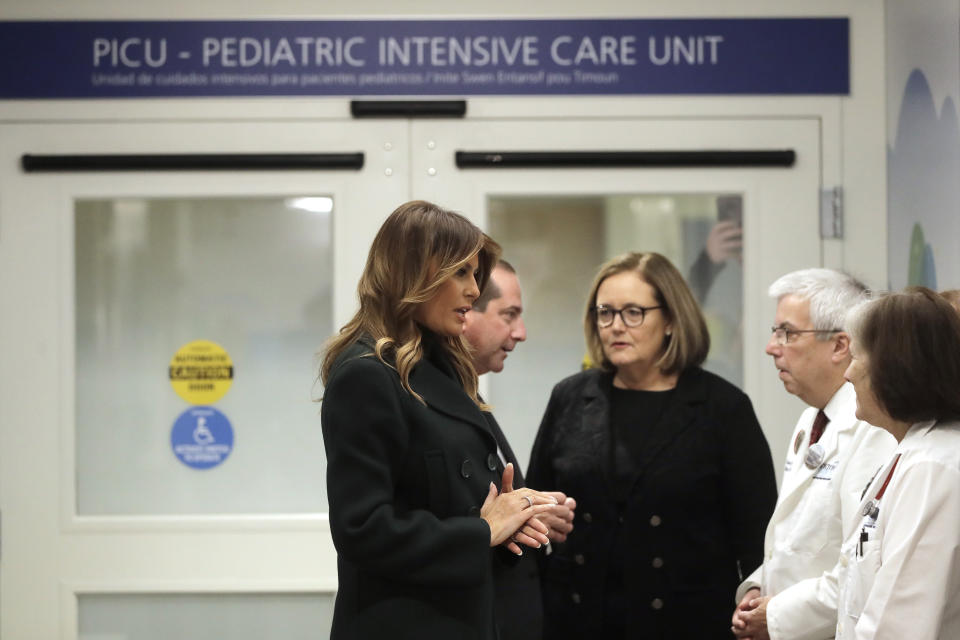 First lady Melania Trump, left, joins in conversation with, from the left, U.S. Secretary of Health and Human Services Alex Azar, President and CEO of Boston Medical Center Kate Walsh, Chief of Pediatrics Bob Vinci, and pediatrician Eileen Costello, during a visit to Boston Medical Center, in Boston, Wednesday, Nov. 6, 2019. The visit, part of the first lady's "Be Best" initiative, included the hospital's pediatric intensive care unit. (AP Photo/Steven Senne, Pool)