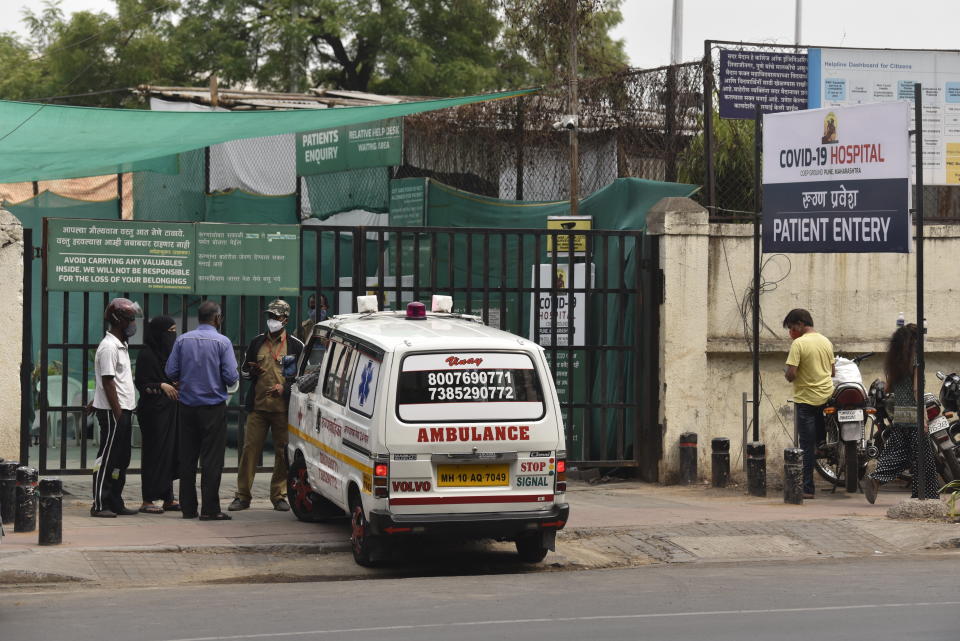 An ambulance stands at the gate of Jumbo Covid hospital in Pune, India, Thursday, April 8, 2021. On Thursday India's western city of Pune was running out of ventilators. The Indian city of Pune is running out of ventilators as gasping coronavirus patients crowd its hospitals. The surge, which can be seen across India, is particularly alarming because the country is a major vaccine producer and a critical supplier to the U.N.-backed COVAX initiative. (AP Photo)