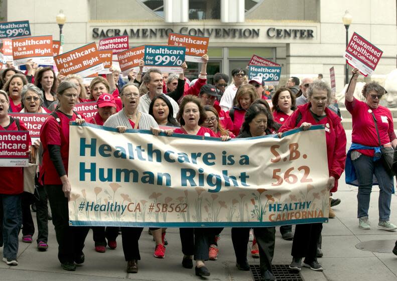 Supporters of single-payer health care march to the Capitol Wednesday, April 26, 2017, in Sacramento, Calif. The bill, SB562 by Democratic state Sens. Ricardo Lara, of Bell Gardens, and Toni Atkins, of San Diego, that would guarantee health coverage with no out-of-pocket cost for all California residents, including people living in the country illegally is to be heard in the Senate Health Committee, Wednesday. (AP Photo/Rich Pedroncelli)