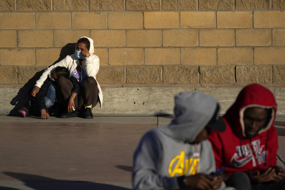 Asylum seekers wait for news of policy changes at the border, Friday, Feb. 19, 2021, in Tijuana, Mexico. After waiting months and sometimes years in Mexico, people seeking asylum in the United States are being allowed into the country starting Friday as they wait for courts to decide on their cases, unwinding one of the Trump administration's signature immigration policies that President Joe Biden vowed to end. (AP Photo/Gregory Bull)