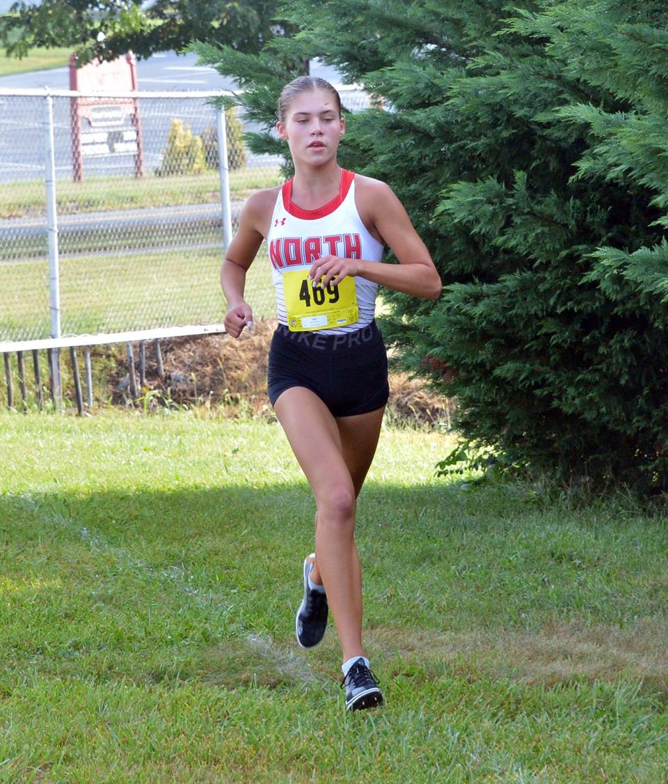 North Hagerstown's Lauren Stine runs alone in the lead of the Rebel Invitational girls race a mile in. Stine won in 19:08.0 with a gap of 1:20 to second place.