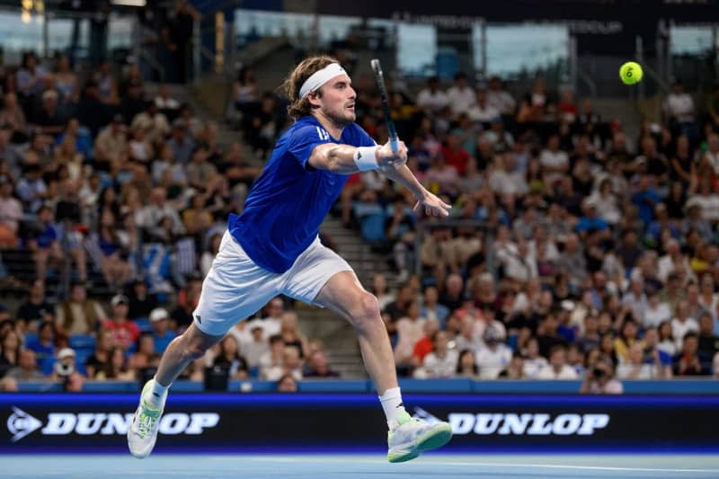 Greek tennis player Stefanos Tsitsipas in action against Germany's Alexander Zverev during their men's singles quarter-final match of the 2024 United Cup at Ken Rosewall Arena in Sydney. Steven Markham/AAP/dpa