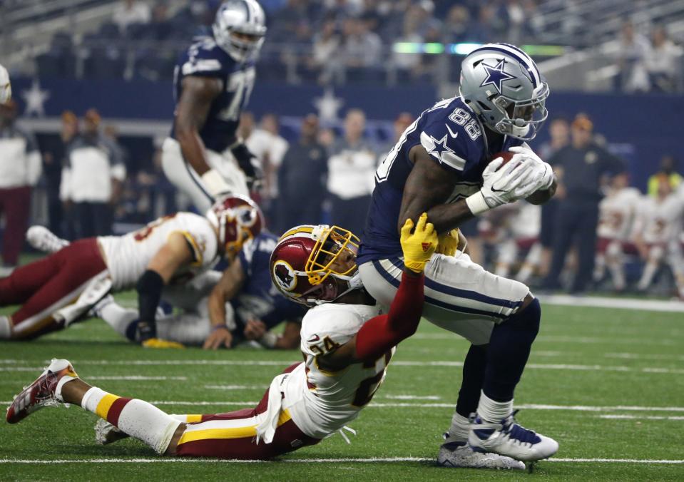 Dez Bryant, right, and Josh Norman were calm early but feisty late on Thanksgiving. (AP)