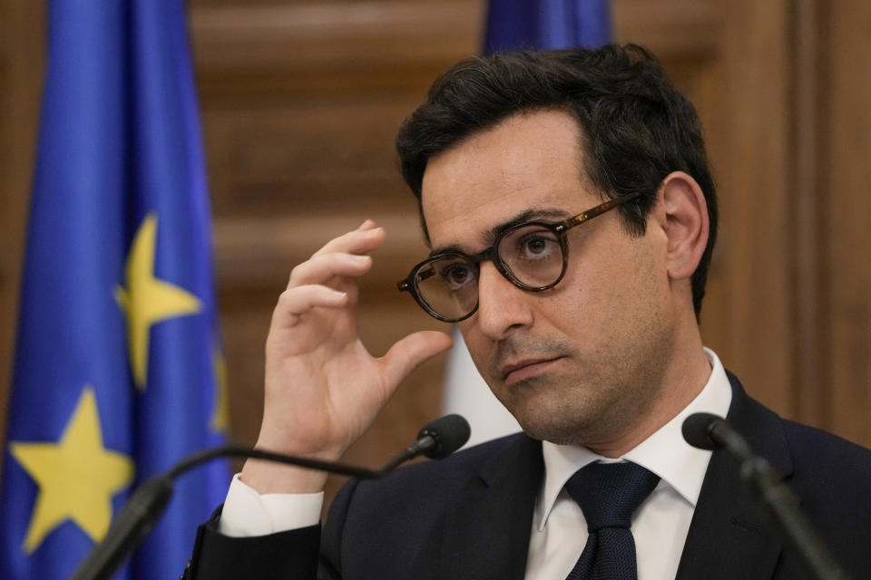 French Foreign Minister Stephane Sejourne adjusts his glasses as he listens to a question during a press conference at the Pine Palace, which is the residence of the French ambassador, in Beirut, Lebanon, Sunday, April 28, 2024. (AP Photo/Hassan Ammar)
