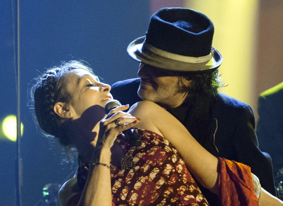 FILE - In this Feb.13, 2015 file photo, French singer Catherine Ringer and Rachid Taha, right, perform during the 30th Victoires de la Musique ceremony, in Paris. Rachid Taha, an Algerian singer who thrillingly blended Arabic music with rock and techno and at times wore blue contact lenses to protest anti-Arab prejudice in France, where he made his home, has died. He was 59. (AP Photo/Jacques Brinon, File)