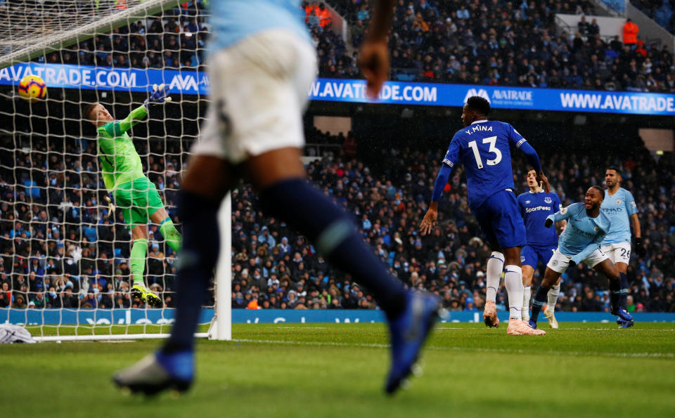 Raheem Sterling heads home City’s clinching third goal at the Etihad