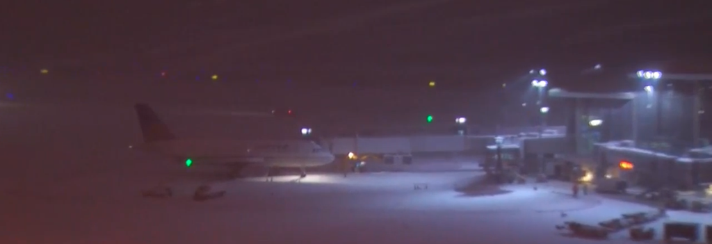 An aeroplane sits on the snow at RDU, shortly after the Delta flight skidded off the runway.  (CBS17)
