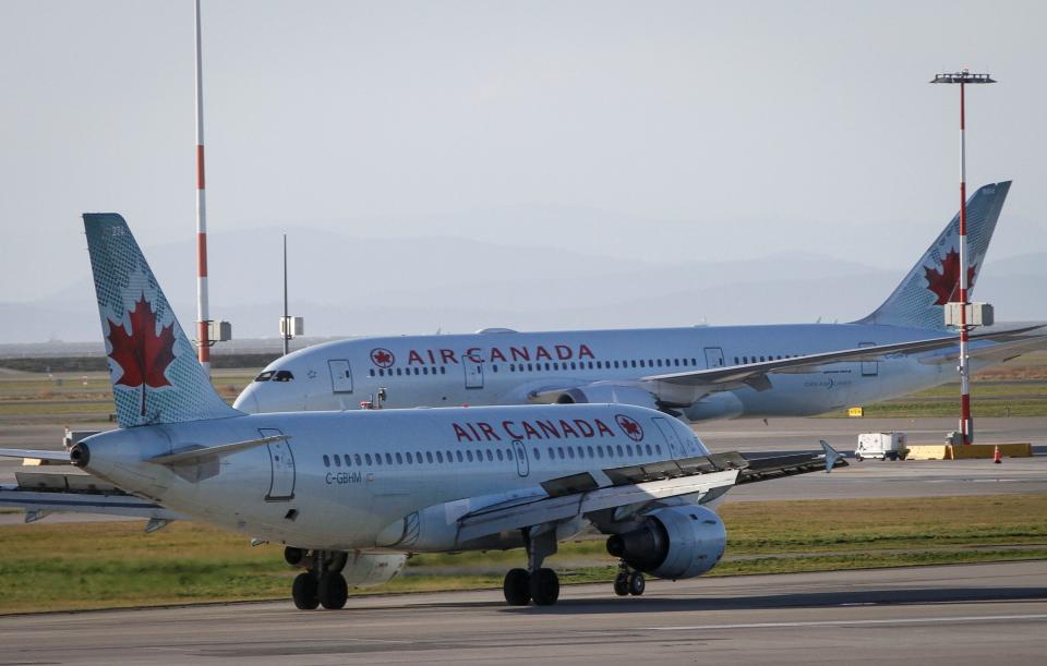 RICHMOND CANADA, Jan. 13, 2021 -- Air Canada aircrafts are seen on the runway of Vancouver International Airport in Richmond, British Columbia, Canada, Jan. 13, 2021. Air Canada announced on Wednesday that it is laying off about 1,700 employees due to official travel restrictions against the rampaging COVID-19 pandemic. (Photo by Liang Sen/Xinhua via Getty) (Xinhua/Liang Sen via Getty Images)