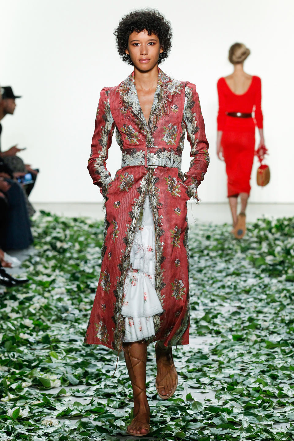 <p>The up-and-coming model made a splash during Brock's NYFW show in a floral dress and belted coat.</p>