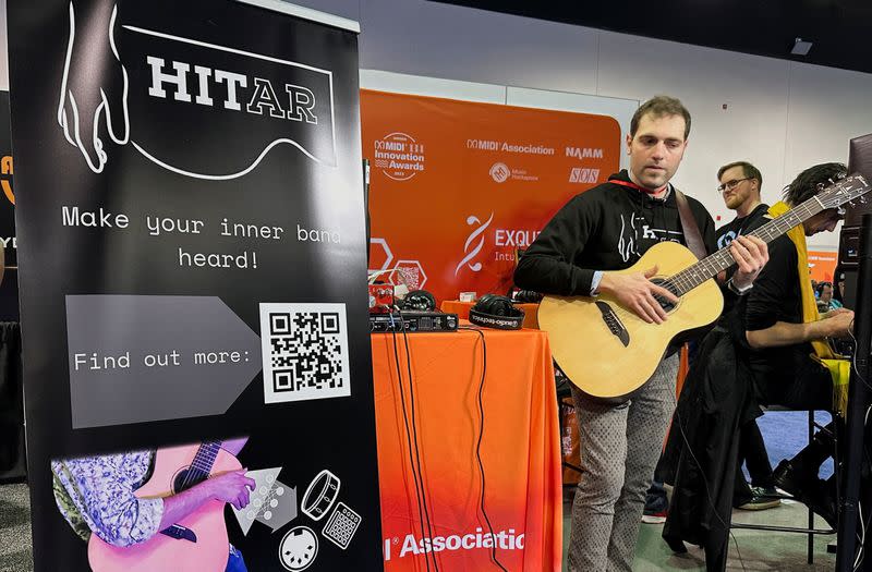 Andrea Martelloni demonstrates the 'HITar', an AI-powered augmented guitar at the 2024 National Association of Music Merchants (NAMM) trade show in Anaheim