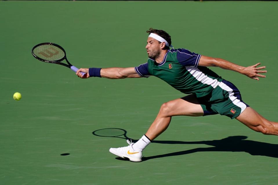 Grigor Dimitrov stretches for a forehand (Mark J Terrill/AP) (AP)