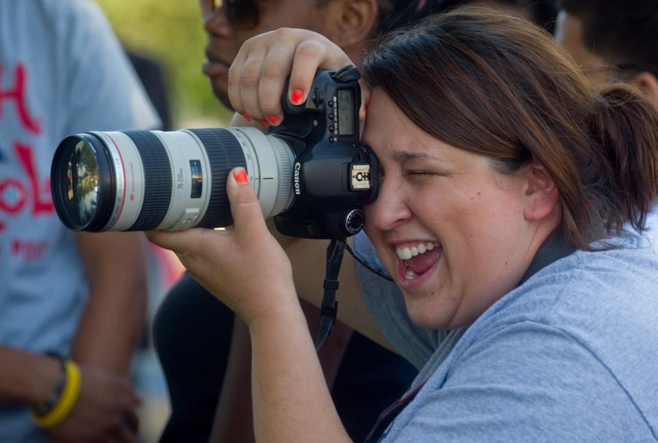 Photographer Whitney Ramirez takes pictures of people participating in the "Dear Stockton" event June 28, 2012, at Stockton City Hall in downtown Stockton.