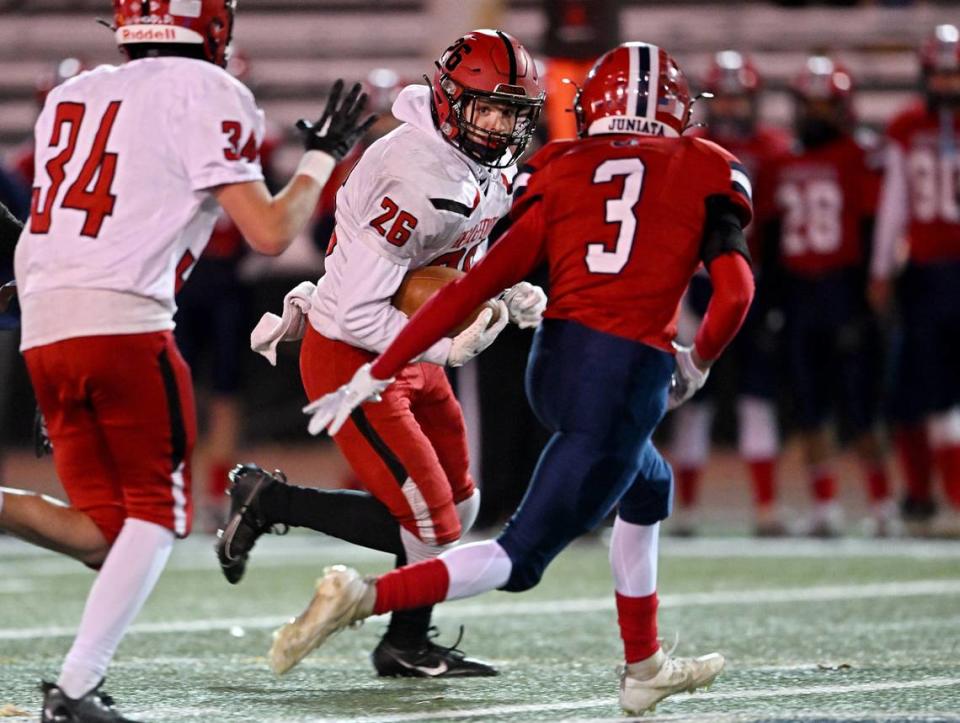 Bellefonte’s Sherman Lowry cuts down the field with the ball from Juniata defenders during District 6 4A championship game on Friday, Nov. 3, 2023.