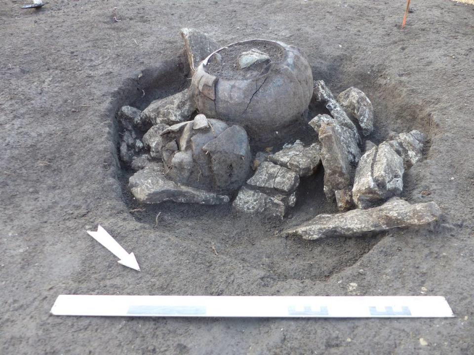 Cremated remains were found in vases placed in a limestone chest, experts said.