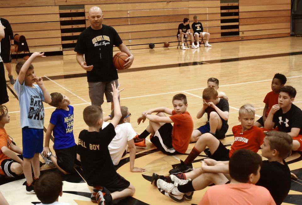 Former Cuyahoga Falls coach and current athletic director Ken Johnson, talks to a group of kids in 2018.
