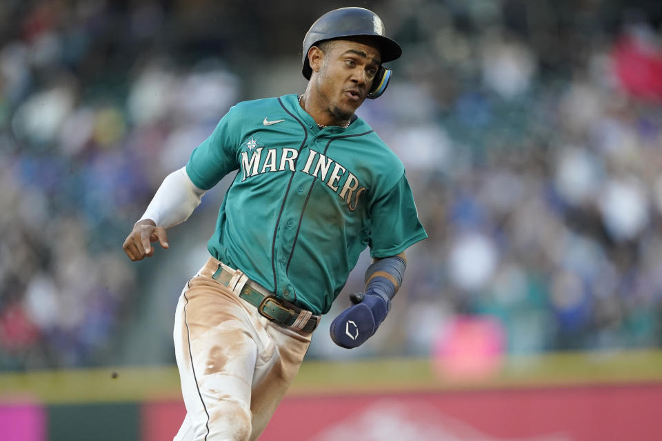 Seattle Mariners' Julio Rodriguez runs on the way to scoring on a double by J.P. Crawford during the third inning of the team's baseball game against the Toronto Blue Jays, Friday, July 8, 2022, in Seattle. (AP Photo/Ted S. Warren)