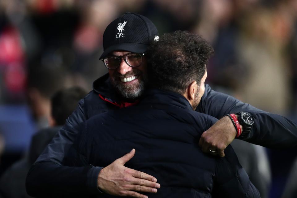 Liverpool's manager Jurgen Klopp , left, hugs Atletico Madrid's head coach Diego Simone before a 1st leg, round of 16, of the Champions League soccer match between Atletico Madrid and Liverpool at the Wanda Metropolitano stadium in Madrid, Tuesday, Feb. 18, 2020. (AP Photo/Manu Fernandez)