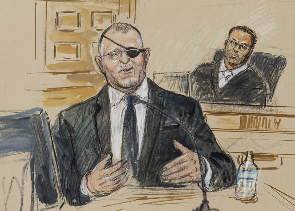 This artist sketch depicts the trial of Oath Keepers leader Stewart Rhodes, left, as he testifies before U.S. District Judge Amit Mehta on charges of seditious conspiracy in the Jan. 6, 2021, Capitol attack, in Washington, Monday, Nov. 7, 2022. Rhodes is on trial with four others for what prosecutors have alleged was a plan to stage an armed rebellion to stop the transfer of presidential power. (Dana Verkouteren via AP)