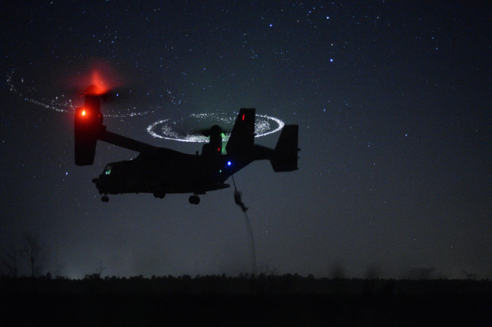 Combat controllers from the 21st Special Tactics Squadron fast-rope from a CV-22 Osprey during Emerald Warrior near Hurlburt Field, Florida, April 21, 2015.