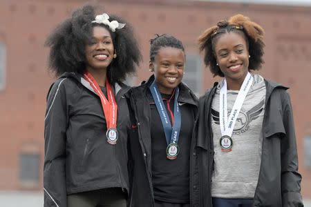 Jun 21, 2018; Des Moines, IA, USA; Women's triple jump winner Keturah Orji of Georgia (middle) poses with runner-up Tori Franklin (left) and third-place finisher Imani Oliver during the USA Championships at Drake Stadium. Kirby Lee-USA TODAY Sports