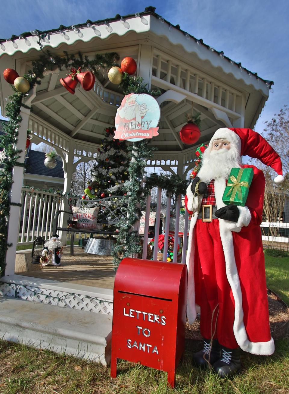 A decked out gazebo with Santa and a “Letters to Santa” mail box in the front yard of Donna Norman's home on Spencer Mountain Road in Ranlo where a special Christmas event was held Saturday afternoon, Dec. 19, 2020.