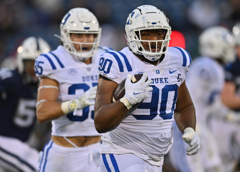 EAST HARTFORD, CT - SEPTEMBER 23: Duke Blue Devils defensive tackle DeWayne Carter (90) picks up the loose ball for the score during the game as the Duke Blue Devils take on the UConn Huskies on September 23, 2023, at the Rentschler Field in East Hartford, Connecticut. (Photo by Williams Paul/Icon Sportswire via Getty Images)