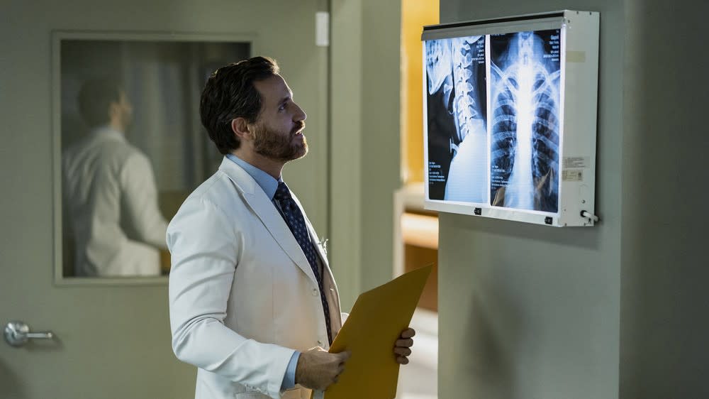  Edgar Ramirez as Paolo looking at an X-ray in Dr. Death season 2. 