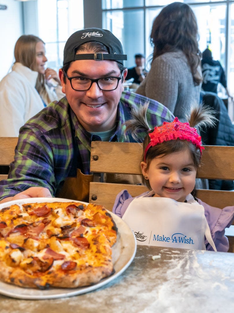 Three-year-old Westchester County resident Charlotte with Culinary Director Paul Failla at the Fortina in Stamford, Connecticut as part of a partnership with Make-A-Wish. Charlotte, who's been battling leukemia, created a "Princess Pizza" with marinara, shredded mozzarella, pepperoni, bacon, and chicken tenders that will be on the Fortina menu in March.
