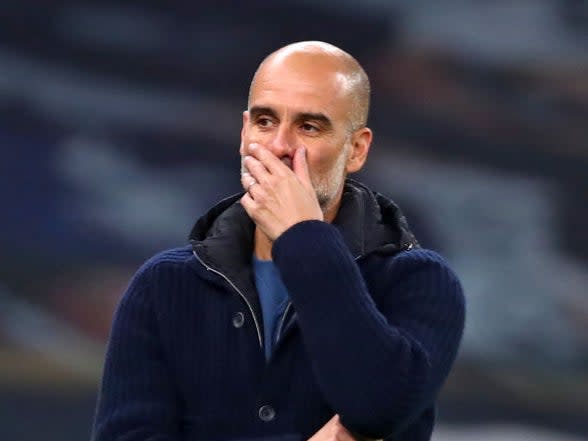 Pep Guardiola gestures on the touchline (POOL/AFP)