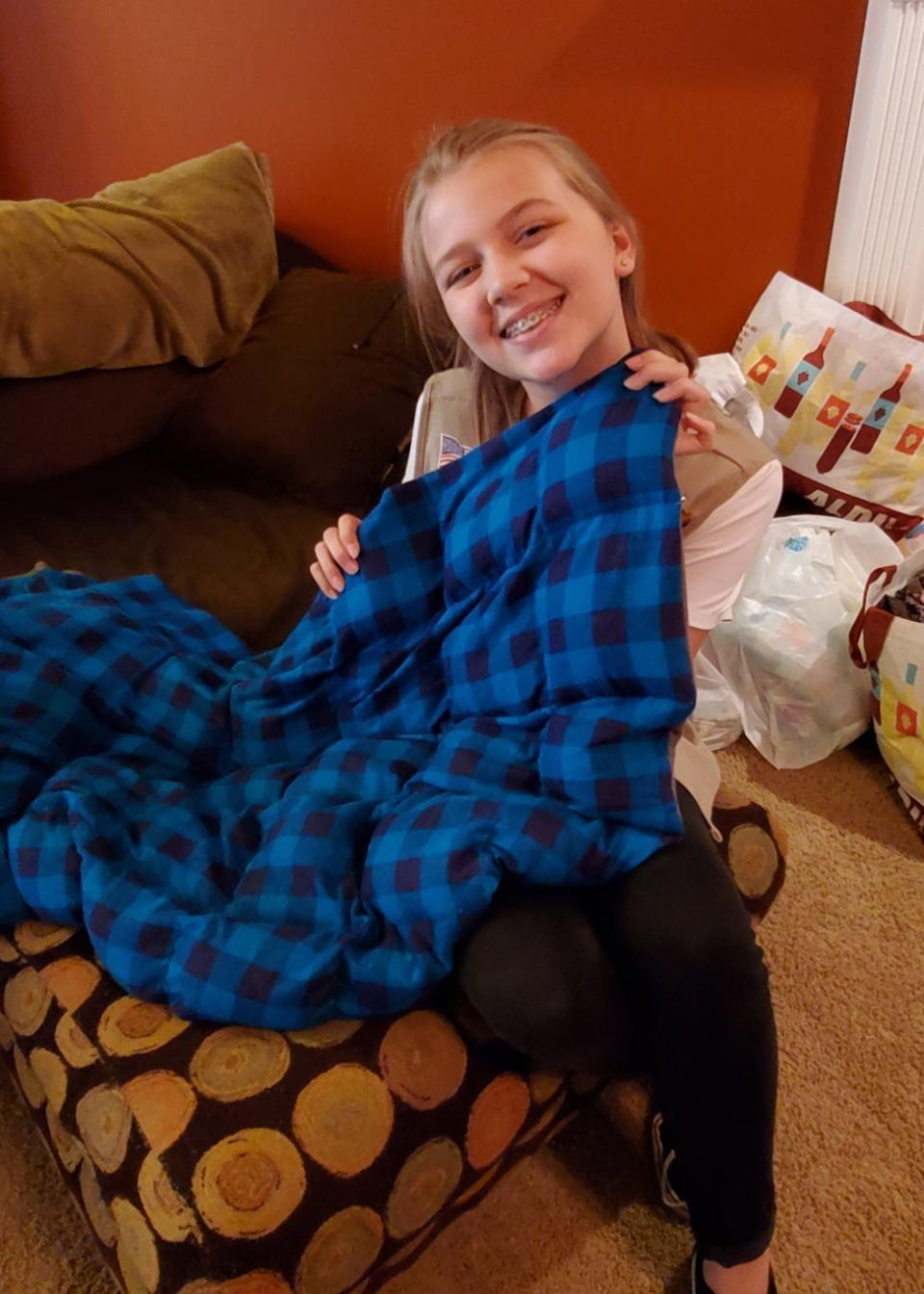 Avery Hanson works on a weighted blanket in Karns in 2019.