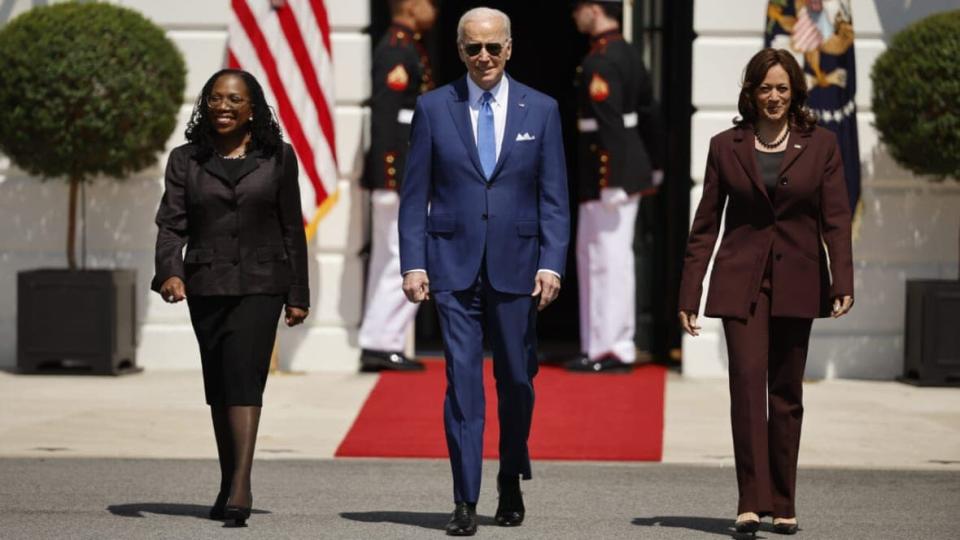 (L-R) Judge Ketanji Brown Jackson, U.S. President Joe Biden and Vice President Kamala Harris walk out of the White House on April 8, 2022 for an event celebrating Jackson’s confirmation to the U.S. Supreme Court on the South Lawn in Washington, D.C. (Photo by Chip Somodevilla/Getty Images)