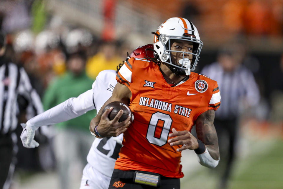 Oklahoma State running back Ollie Gordon II (0) runs for a touchdown against Cincinnati during the second half of an NCAA college football game Saturday, Oct. 28, 2023, in Stillwater, Okla. (AP Photo/Mitch Alcala)